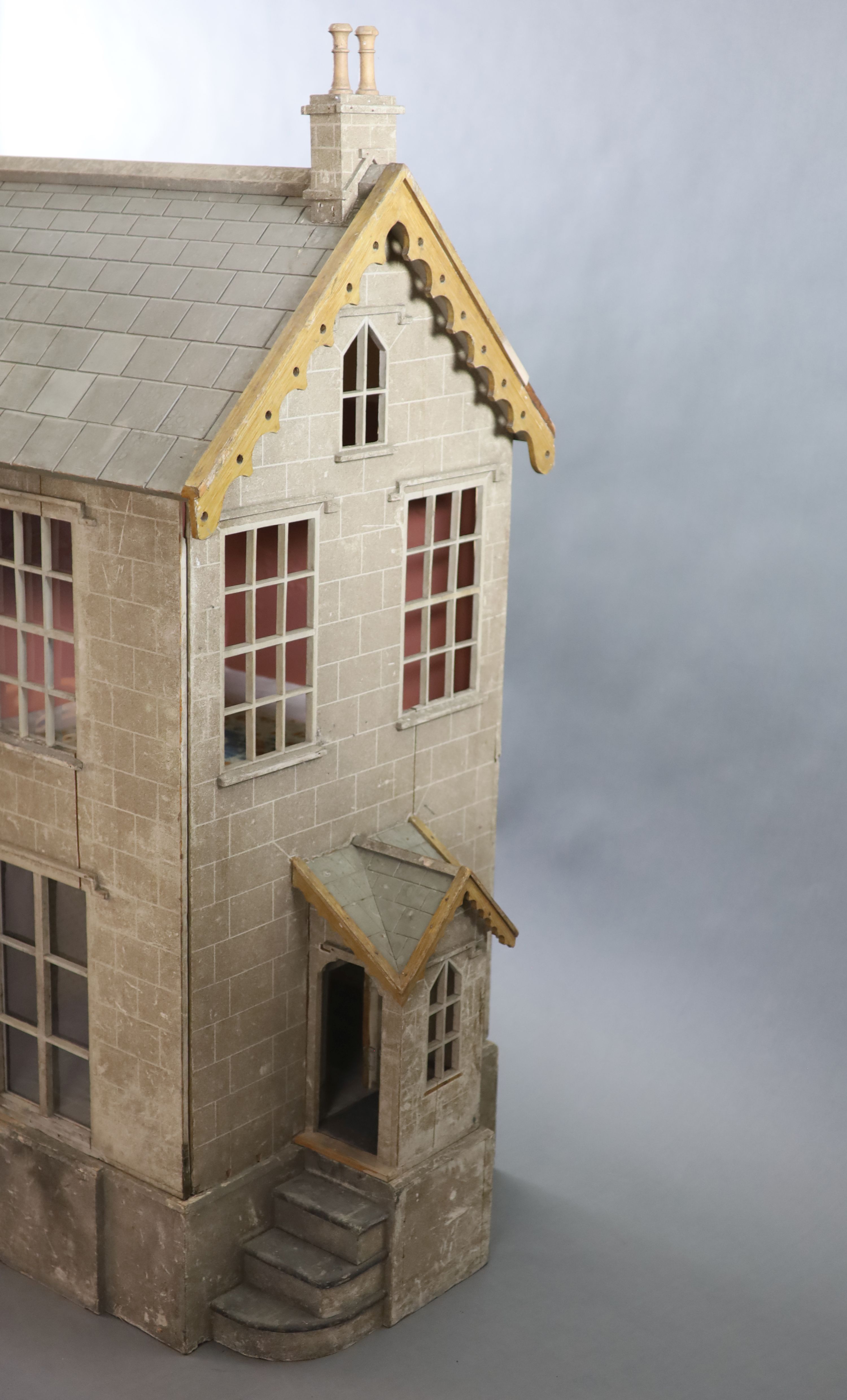 An unusually large painted pine doll's house, modelled upon a Victorian lodge house, Estate Carpenter made, Lake District width 198cm height 156cm